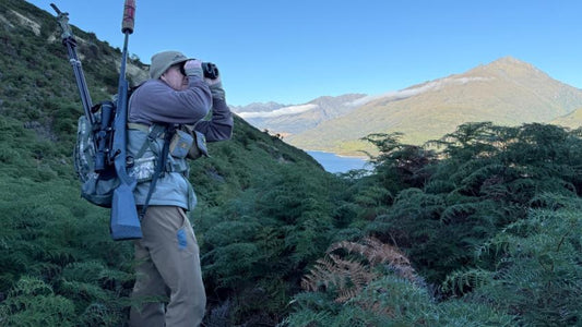 Best bino chest pack in use by elk hunter scanning mountain wilderness with binoculars