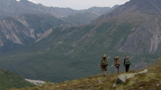 Hunting backpacks carrying equipment, game, and supplies across rugged terrain