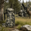 The Moxule camo hunting backpack & BINO R1 binoculars chest pack set, featuring a camouflage pattern, are ideal for wilderness hunting and tactical outdoor travel.
