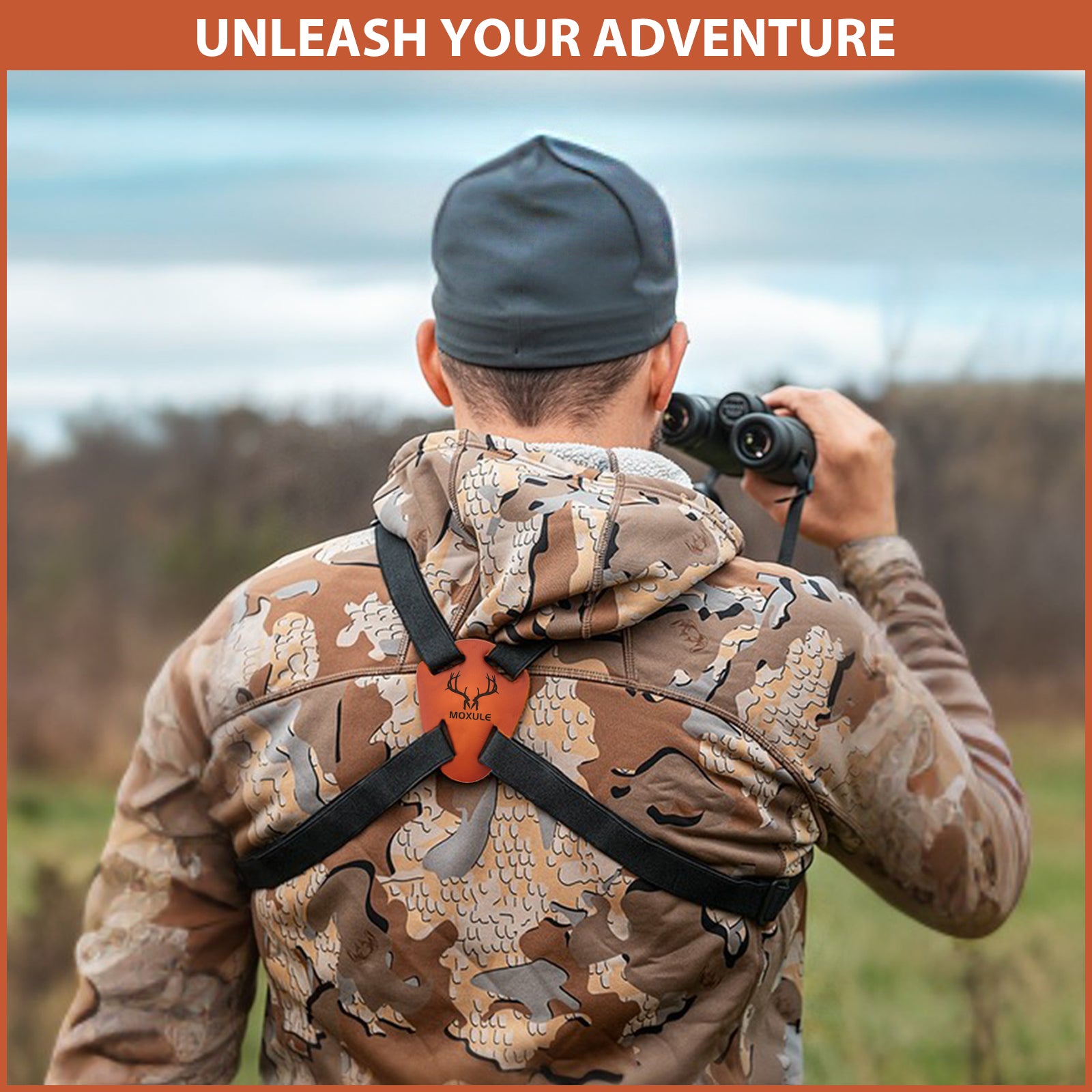A hunter in camouflage uses the Moxule ergonomic carrying system to carry binoculars.