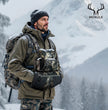 Moxule’s camo hand muff  ideal for winter hunting expeditions.  warmth retention, and gear organization for snowy outdoor environments.