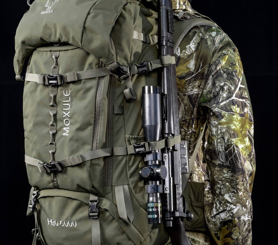 MOXULE PRO 5000 Green Hunting Backpack. Supports external rifle attachments, waterproof nylon fabric, and reinforced buckles.