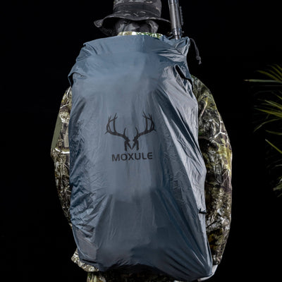 MOXULE hunting backpack rain cover, designed to withstand unpredictable weather conditions during outdoor hunting scenarios.
