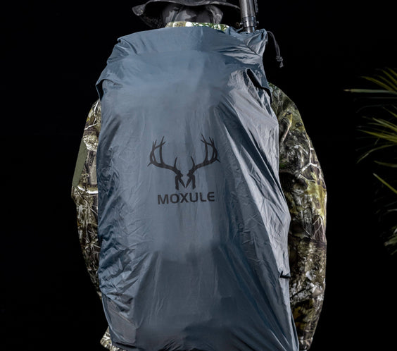 MOXULE hunting backpack rain cover, designed to withstand unpredictable weather conditions during outdoor hunting scenarios.