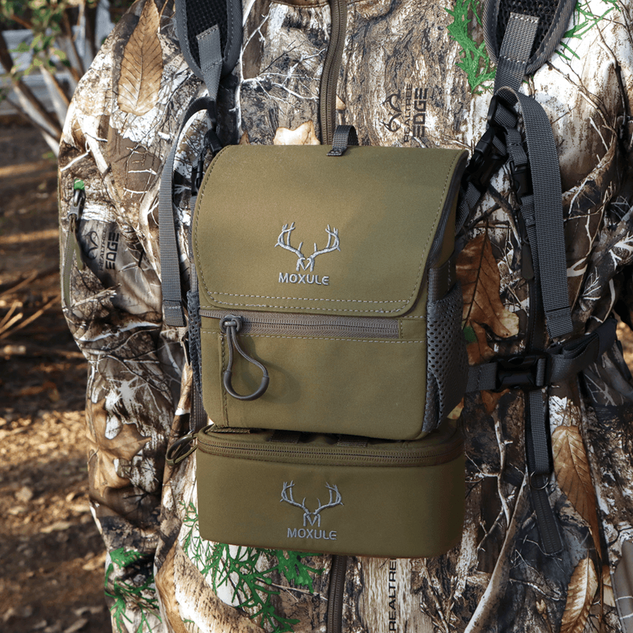 Moxule olive green bino harness worn by hunter in Realtree camo, with modular storage pouches